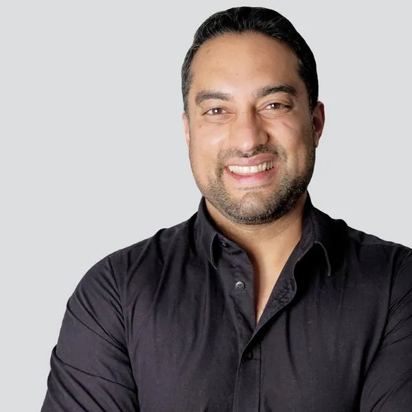 Sharad Mohan, smiling, arms crossed
